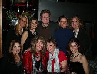 image of Dr. Weinstein and the staff at Weinstein Plastic Surgery Center posing for a holiday picture in December 2010
